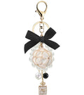Camellia Flower Purse Charm Keychain with Bow and Pearl Accents - color: Whitee