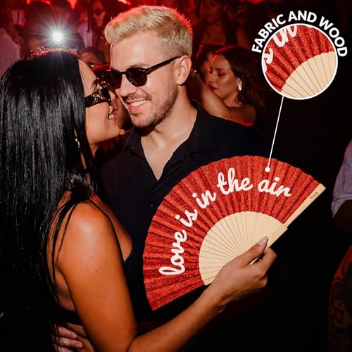 Fisura – Original folding fan with “Love Is in the Air” message. Modern and colorful wooden folding fan. Red glitter folding fan. Includes strap. Fun gift idea. 16.7 x 9 in. - color: Love is in the Air, Red